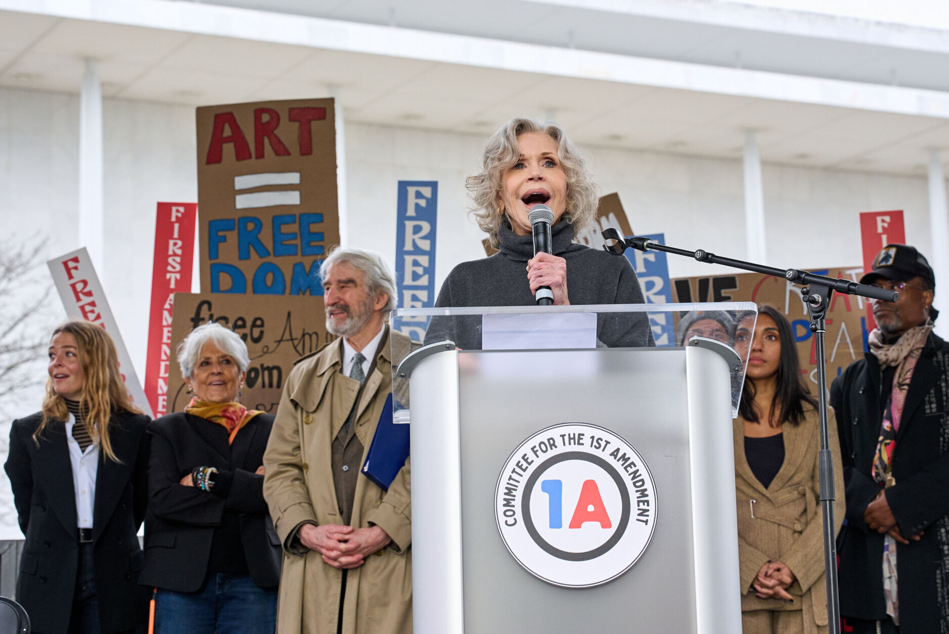 Jane Fonda, center, speaks alongside, from left, singer Maggie Rogers, actor Sam Waterston, poet Rupi Kaur and actor Billy Porter during an, "Artists United for Our Freedoms," rally near the Kennedy Center, Friday, March 27, 2026, in Washington. (AP Photo/Jacquelyn Martin)