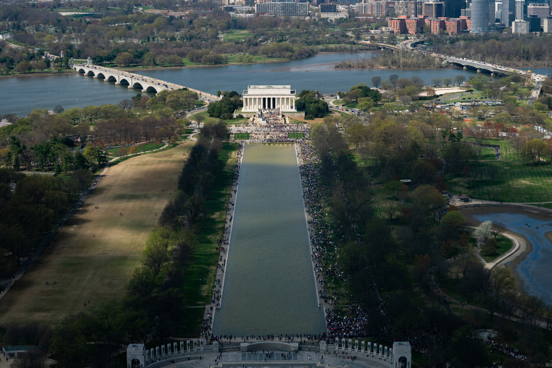 Demonstrators march down the National Mall during the No Kings protest in Washington, Saturday, March 28, 2026. (AP Photo/Allison Robbert)