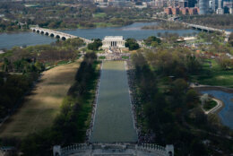 Demonstrators march down the National Mall during the No Kings protest in Washington, Saturday, March 28, 2026. (AP Photo/Allison Robbert)