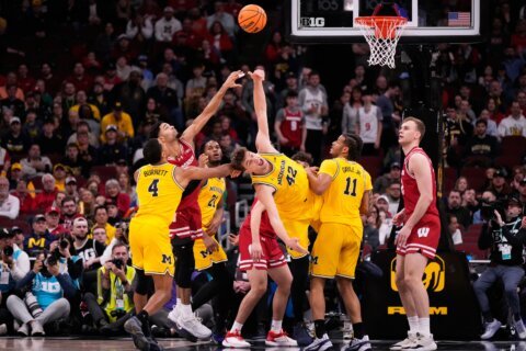 Lendeborg makes a tiebreaking 3 as No. 3 Michigan tops No. 23 Wisconsin 68-65 in Big Ten semis