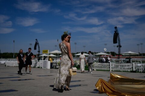 Photos show glamour at the Dubai World Cup horse race but thinner crowds due to Iran war