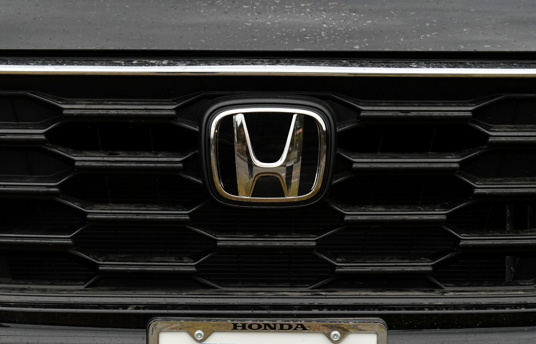 SAN RAFAEL, CALIFORNIA - OCTOBER 16: The Honda logo is displayed on a Honda CR-V SUV at Honda Marin on October 16, 2024 in San Rafael, California. Honda announced the recall of 720,000 cars and SUVs due to defective high-pressure fuel pumps that could develop cracks that would allow fuel leaks. The models being recalled are the 2023-2024 Accord and Accord Hybrid, 2023-2025 Honda CR-V Hybrid. and 2025 Civic Sedan and Civic Sedan Hybrid. (Photo by Justin Sullivan/Getty Images)