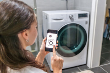 Woman using smart appliance