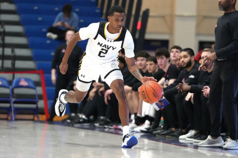 Cole scores 16 as Navy knocks off Bucknell 74-69 in Patriot League Tournament