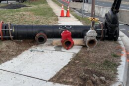 pipe laying on sidewalk