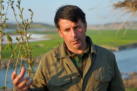 Kurdish Iranian dissidents in Iraq deny attack plans but say they would join a US invasion of Iran