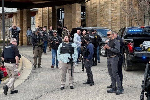 The Latest:  Man fatally shot attacking Michigan synagogue, AP source says