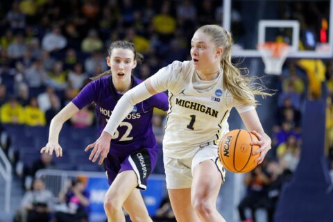 March Madness mismatch: No. 2 Michigan routs Holy Cross 83-48 in women’s NCAA Tournament