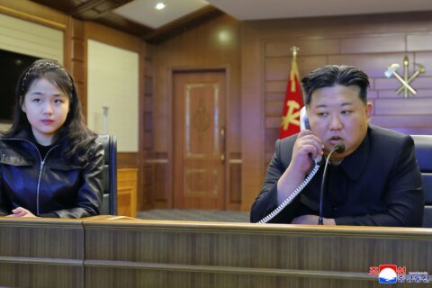 North Korean leader Kim watches cruise missile tests with his daughter