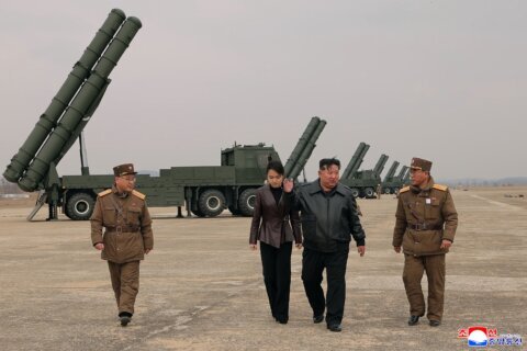 North Korean leader Kim observes test of rocket launch systems with his daughter