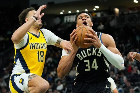 Giannis Antetokounmpo leaves Bucks’ victory over Pacers after landing awkwardly on dunk