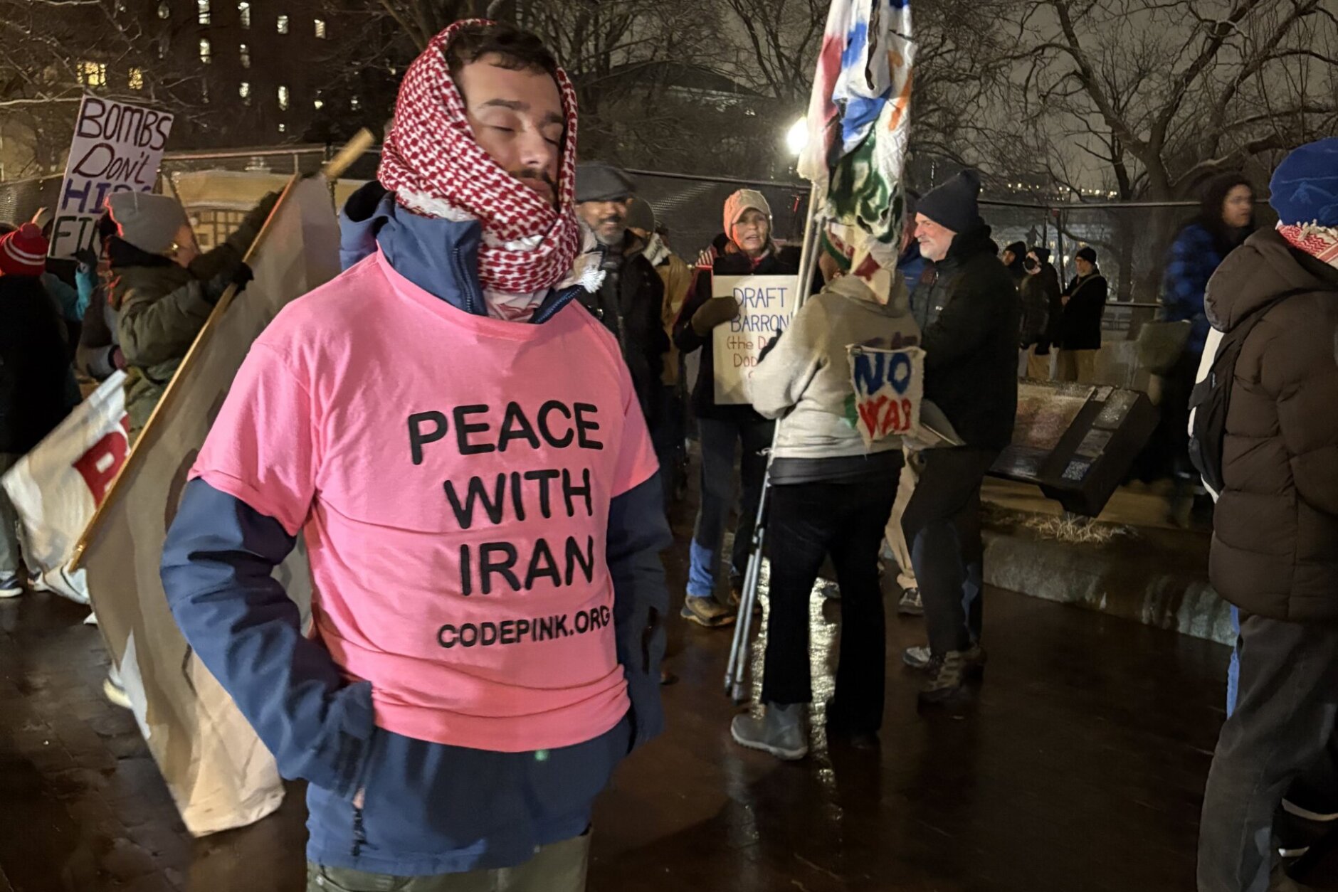 At least one of the protesters was seen wearing a pink t-shirt that read 'Peace with Iran' outside the White House, on Monday, March 2, 2026.