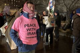 At least one of the protesters was seen wearing a pink t-shirt that read 'Peace with Iran' outside the White House, on Monday, March 2, 2026.