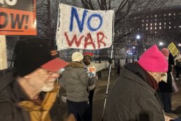 'No War' sign held by protester outside the White House, on Monday, March 2, 2026.