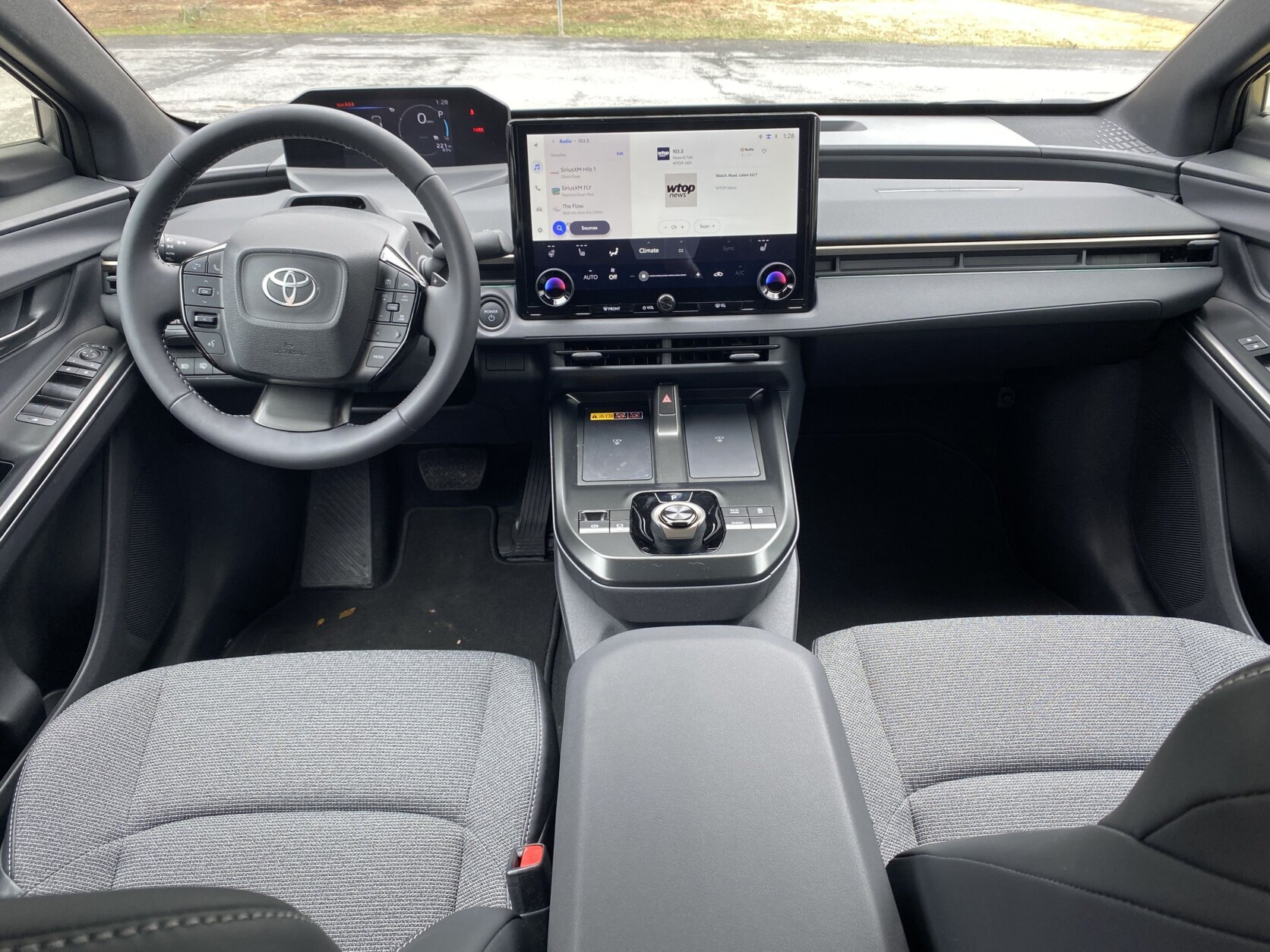 front seats and dash of car pictured from rear seats