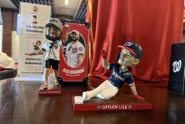 Alex Ovechkin and Daylen Lile bobbleheads.