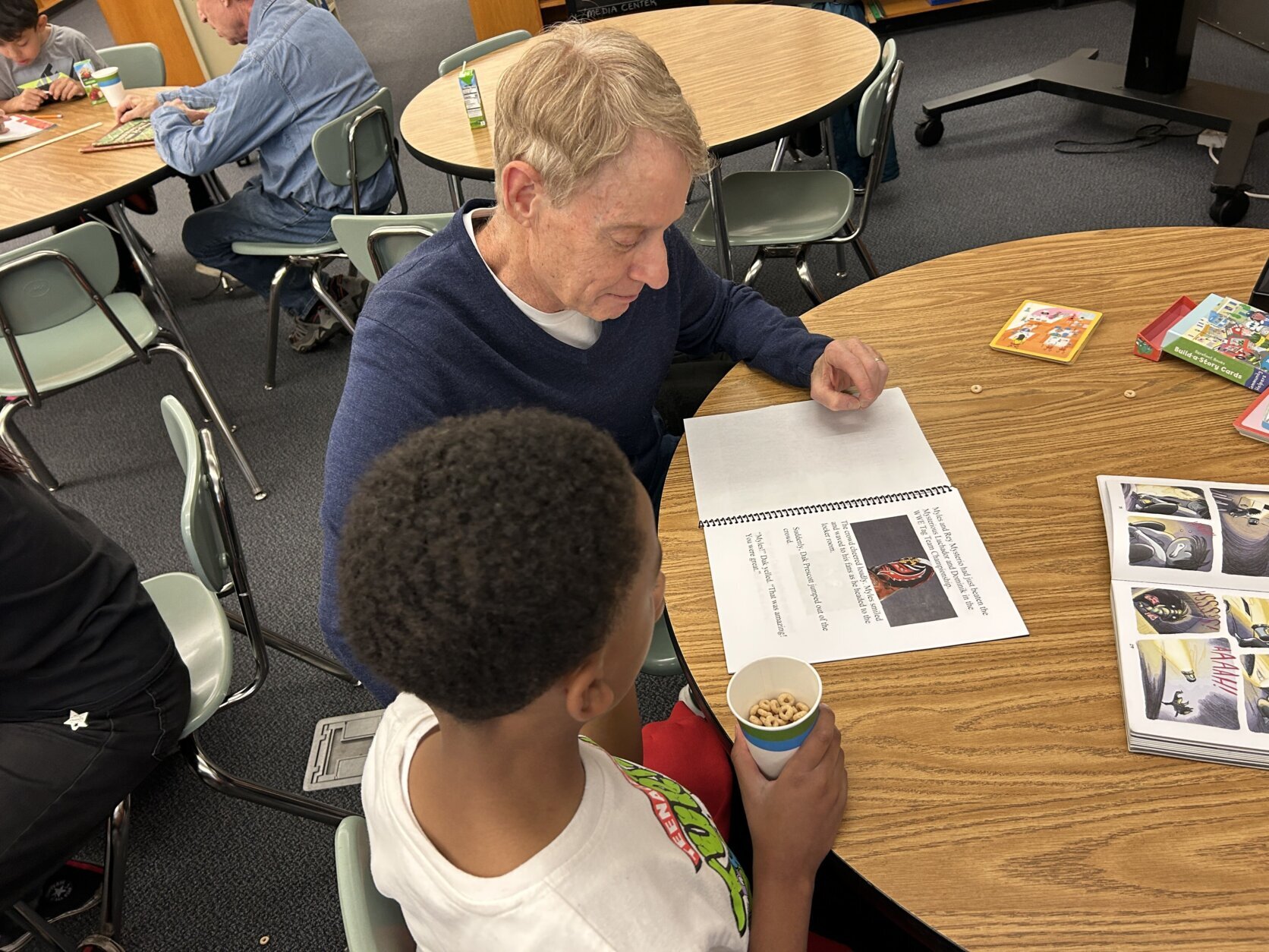 Man reads book to a child.