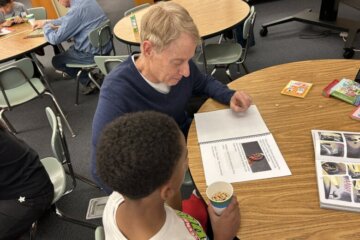 Man reads book to a child.