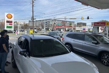 cars being filled up at gas station
