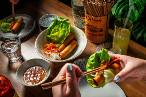 Eating from a bowl with chopsticks