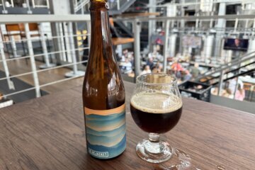 a glass of beer next to a glass