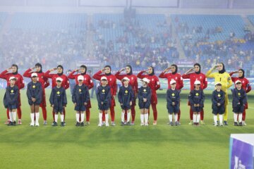 Iranian players salute the national anthem before the Women's Asian Cup match with the Philippines at Gold Coast Stadium on March 8, 2026.