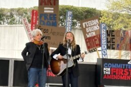 Outside the Kennedy Center, singers Joan Baez (left) and Maggie Rogers (right) perform a song by Bob Dylan, "The Times They Are A-Changin."