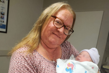 woman holding a newborn baby