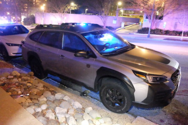 a shoe on the ground next to passenger side door