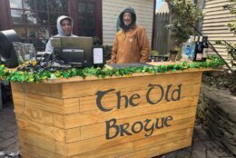 Employees man an outdoor bar at The Old Brogue Irish Pub