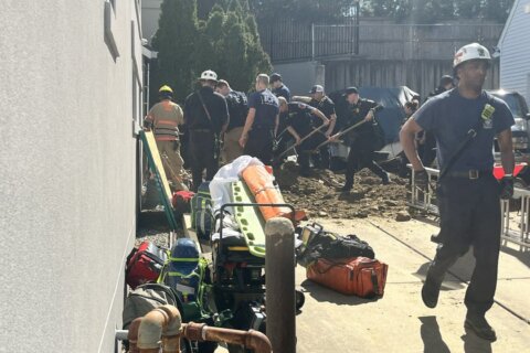 2 construction workers trapped in collapsed trench near Bethesda home