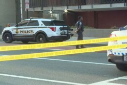 scene of crash with police tape and police cruiser
