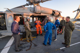 astronauts and recovery team