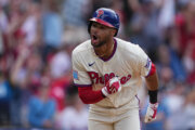 Philadelphia Phillies' Justin Crawford reacts after hitting a one run-single off of Washington Nationals pitcher Cole Henry during the tenth inning of a baseball game, Wednesday, April 1, 2026, in Philadelphia. (AP Photo/Matt Rourke)