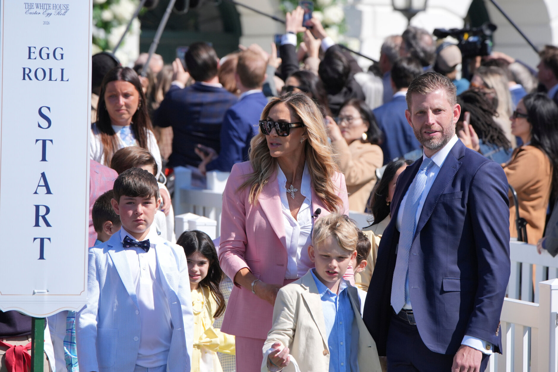 President Donald Trump's son Eric Trump, right, his spouse Lara Trump and their children participate in the White House Easter Egg Roll
