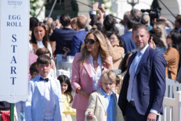 President Donald Trump's son Eric Trump, right, his spouse Lara Trump and their children participate in the White House Easter Egg Roll