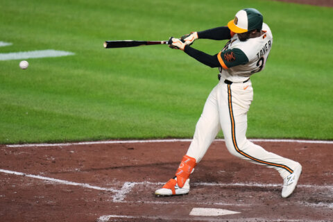 Leody Taveras hits first career grand slam and Orioles hold on for wild 7-5 win over Royals in 12