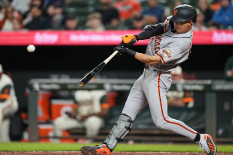 Adames and Lee HRs back solid start by Roupp to propel Giants past Orioles 6-3