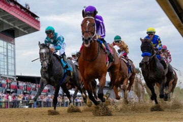 FILE - Jockeys compete during the 150th running of the Preakness Stakes horse race on May 17, 2025, at Pimlico Race Course in Baltimore. (AP Photo/Stephanie Scarbrough, File)