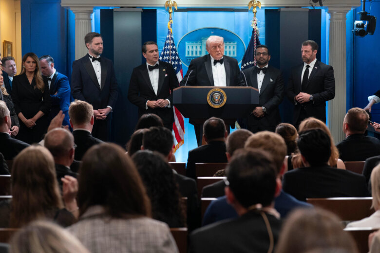 President Donald Trump speaks in the James Brady Press Briefing Room at the White House after an unspecified threat at the annual White House Correspondents' Association Dinner in Washington, Saturday, April 25, 2026, as first lady Melania Trump listens at far left, with White House deputy chief of staff Dan Scavino, Vice President JD Vance, acting Attorney General Todd Blanche, FBI director Kash Patel and Homeland Security Secretary Markwayne Mullin, listen. (AP Photo/Jose Luis Magana)