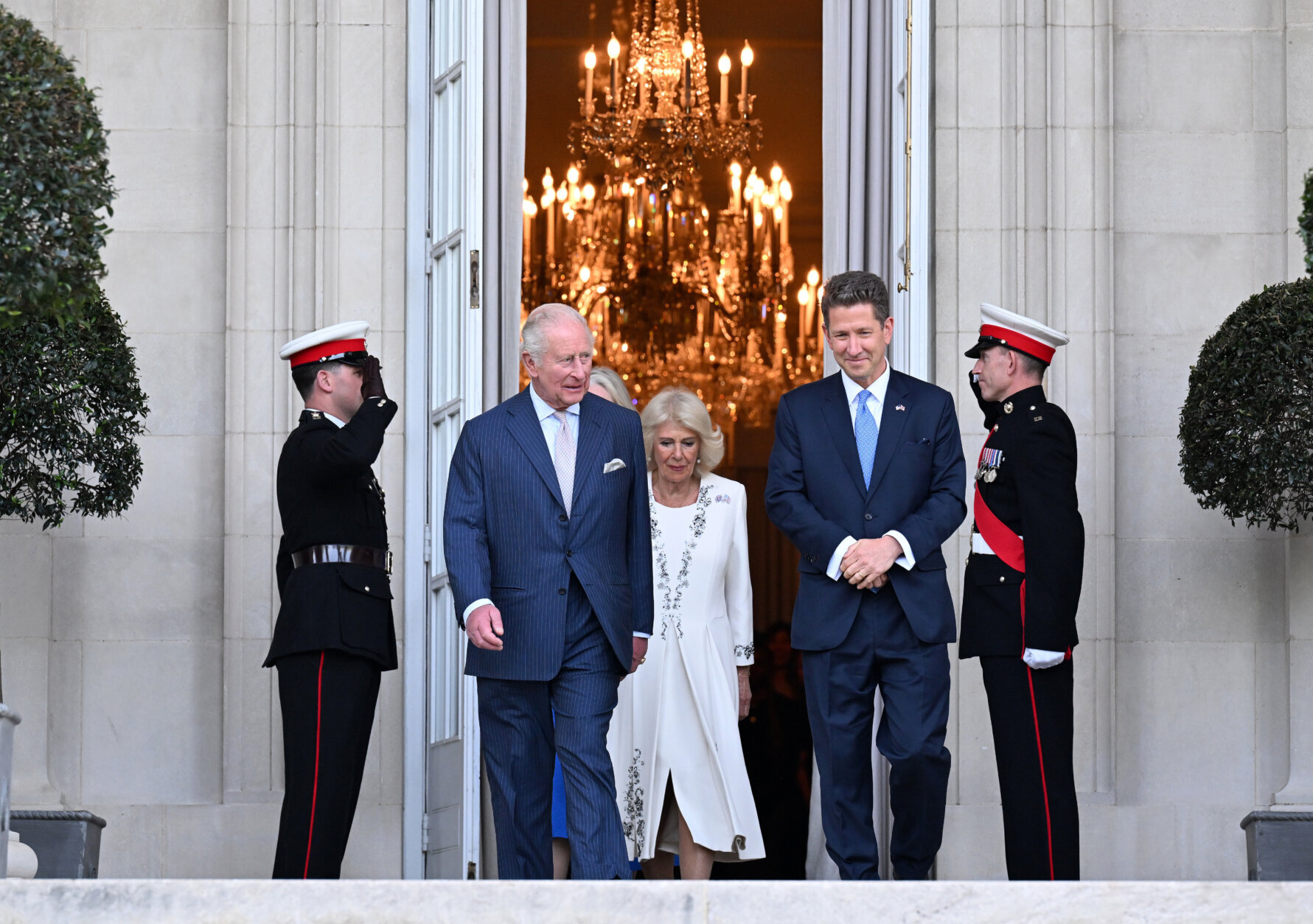Britain's King Charles III and Queen Camilla arrive at a garden party at the British Embassy