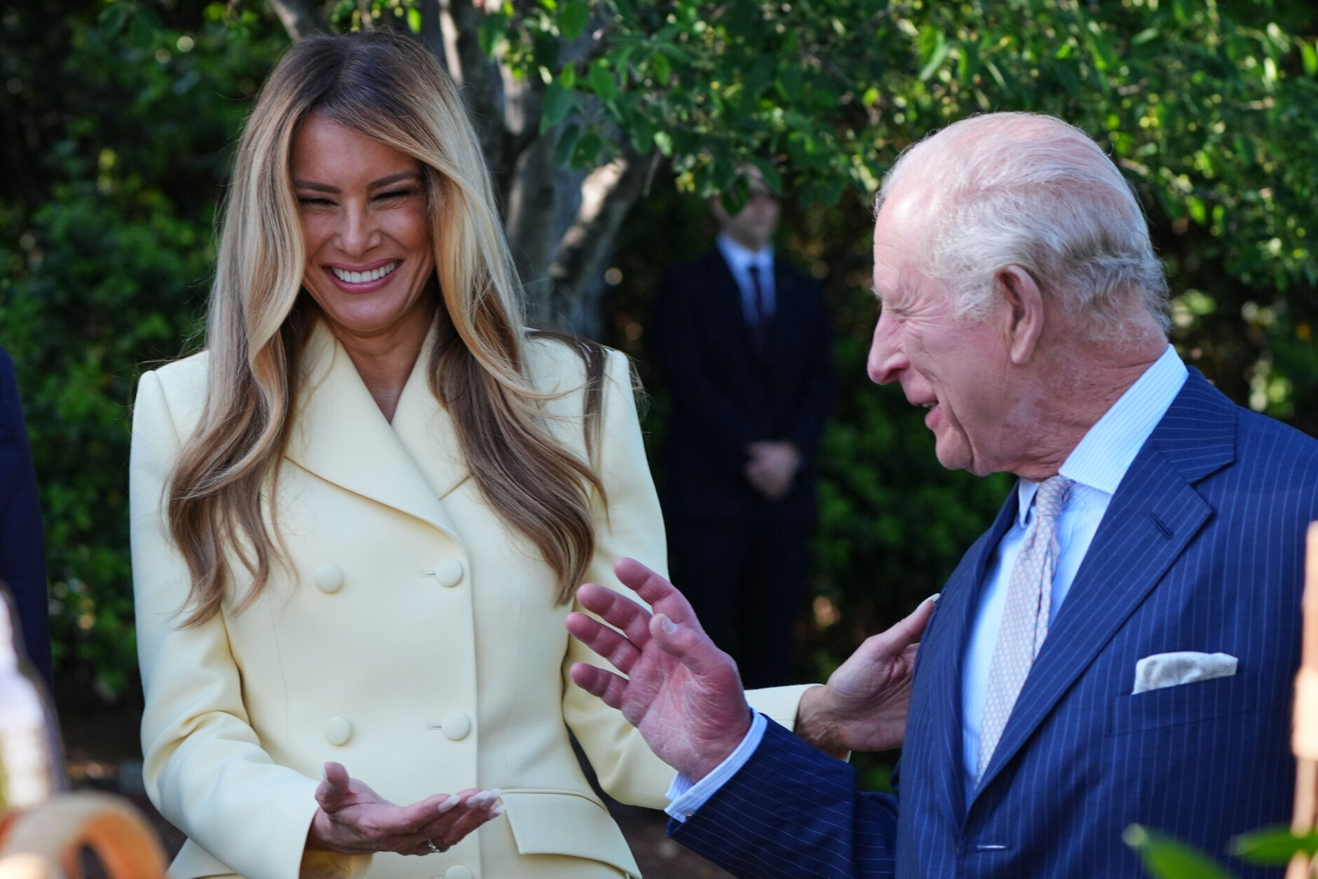 First lady Melania Trump and Britain's King Charles III talk during a tour