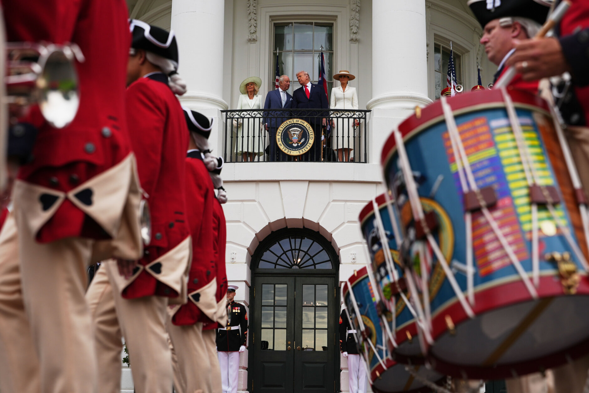 Queen Camilla, King Charles III, President Donald Trump and first lady Melania Trump watch as the United States Army Old Guard Fife and Drum Corps perform