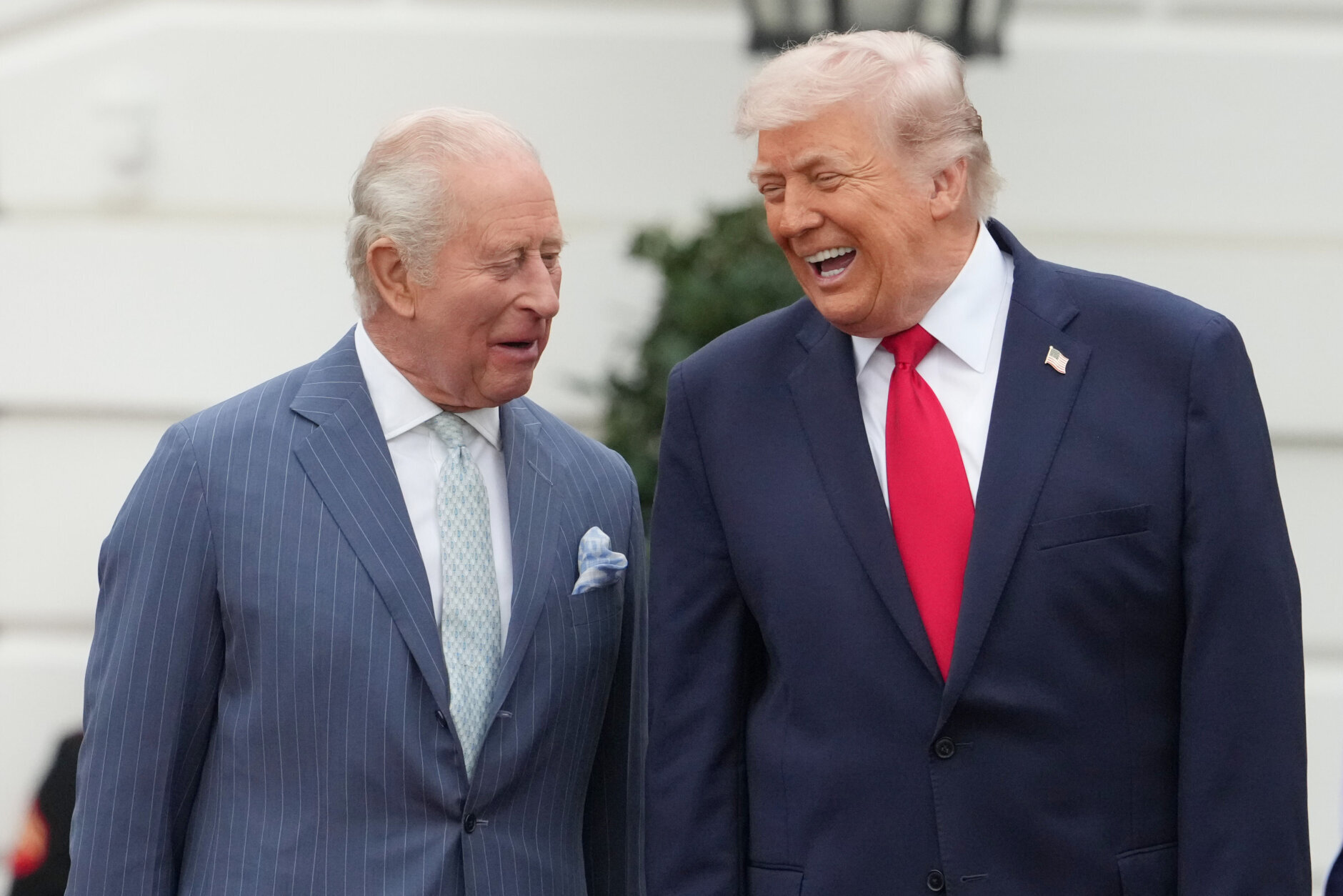 President Donald Trump and Britain's King Charles III talk during a State Visit arrival ceremony