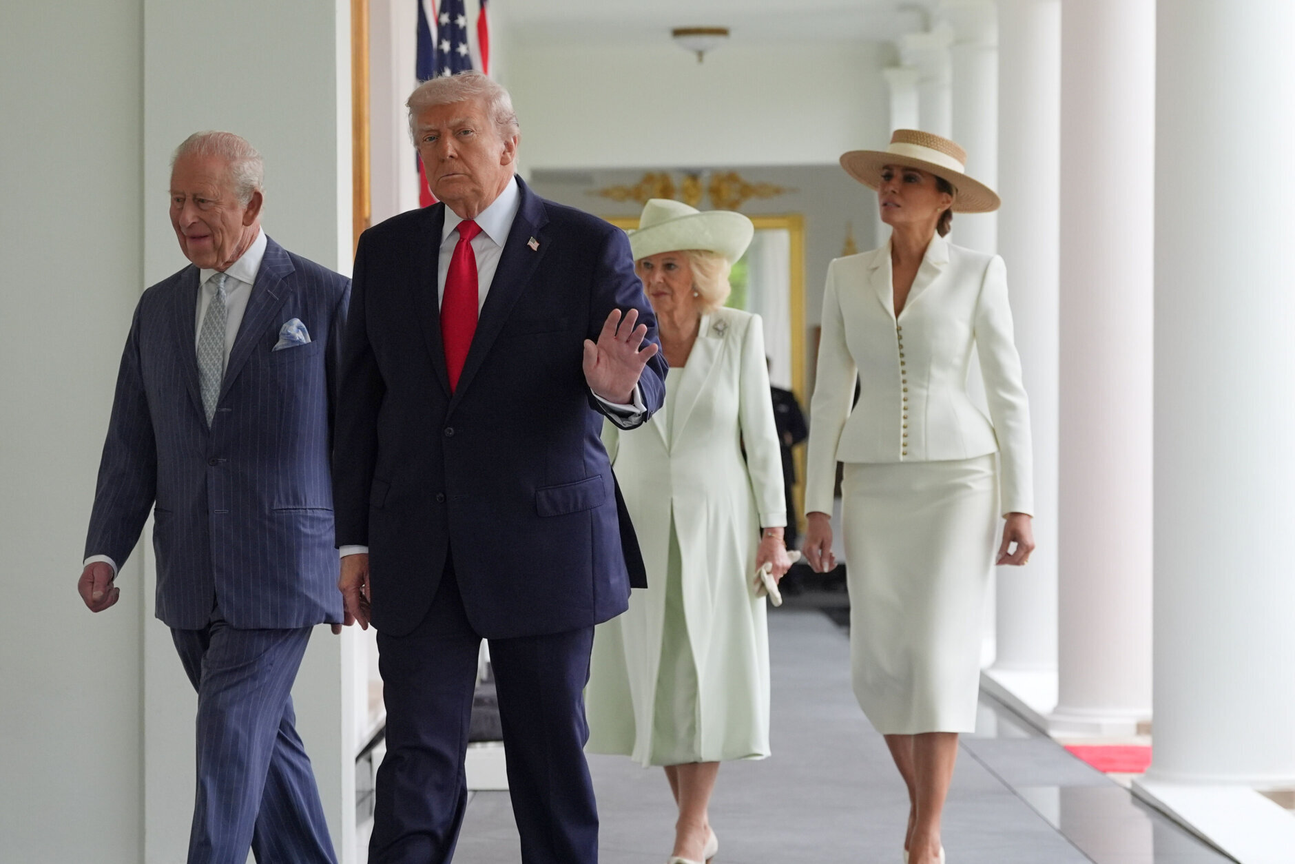 President Donald Trump walks on the West Colonnade with Britain's King Charles III, Queen Camilla and first lady Melania Trump toward the Oval Office