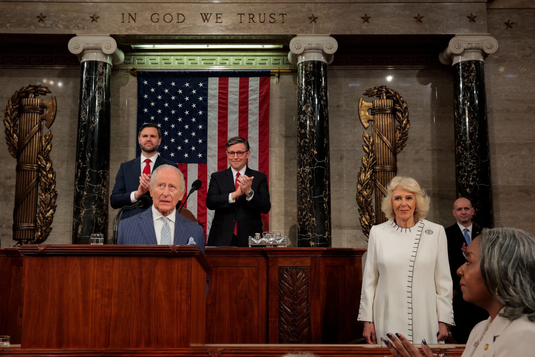 Britain's King Charles III addresses a joint meeting of Congress while Vice President JD Vance, back left, House Speaker Mike Johnson, R-La., back right, applaud and Queen Camilla, right, looks on, in the House Chamber of the U.S. Capitol