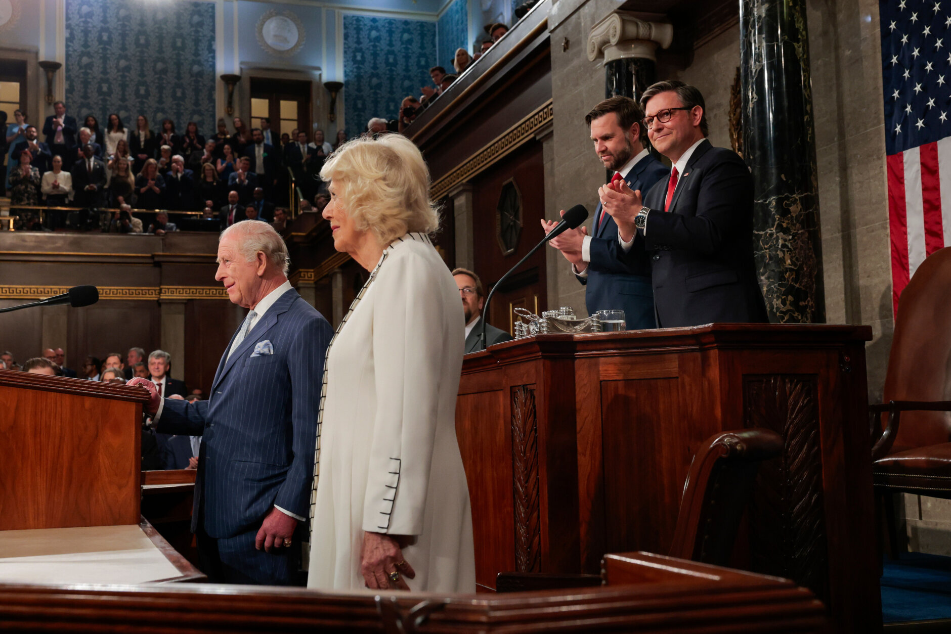 Britain's King Charles III addresses a joint meeting of Congress while Vice President JD Vance, back left, House Speaker Mike Johnson, R-La., back right, applaud and Queen Camilla, right, looks on