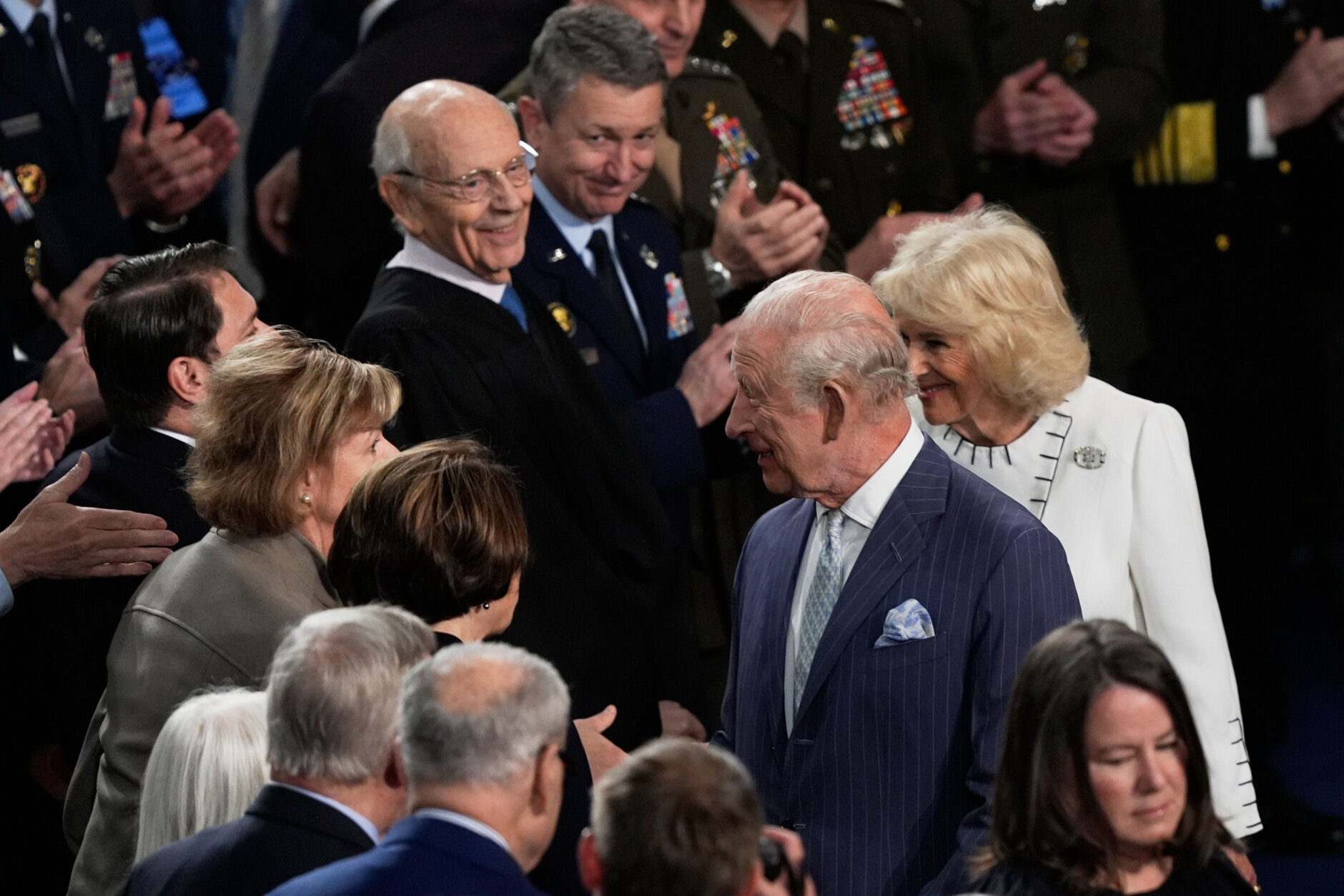 Britain's King Charles III and Queen Camilla are greeted before a joint meeting of Congress
