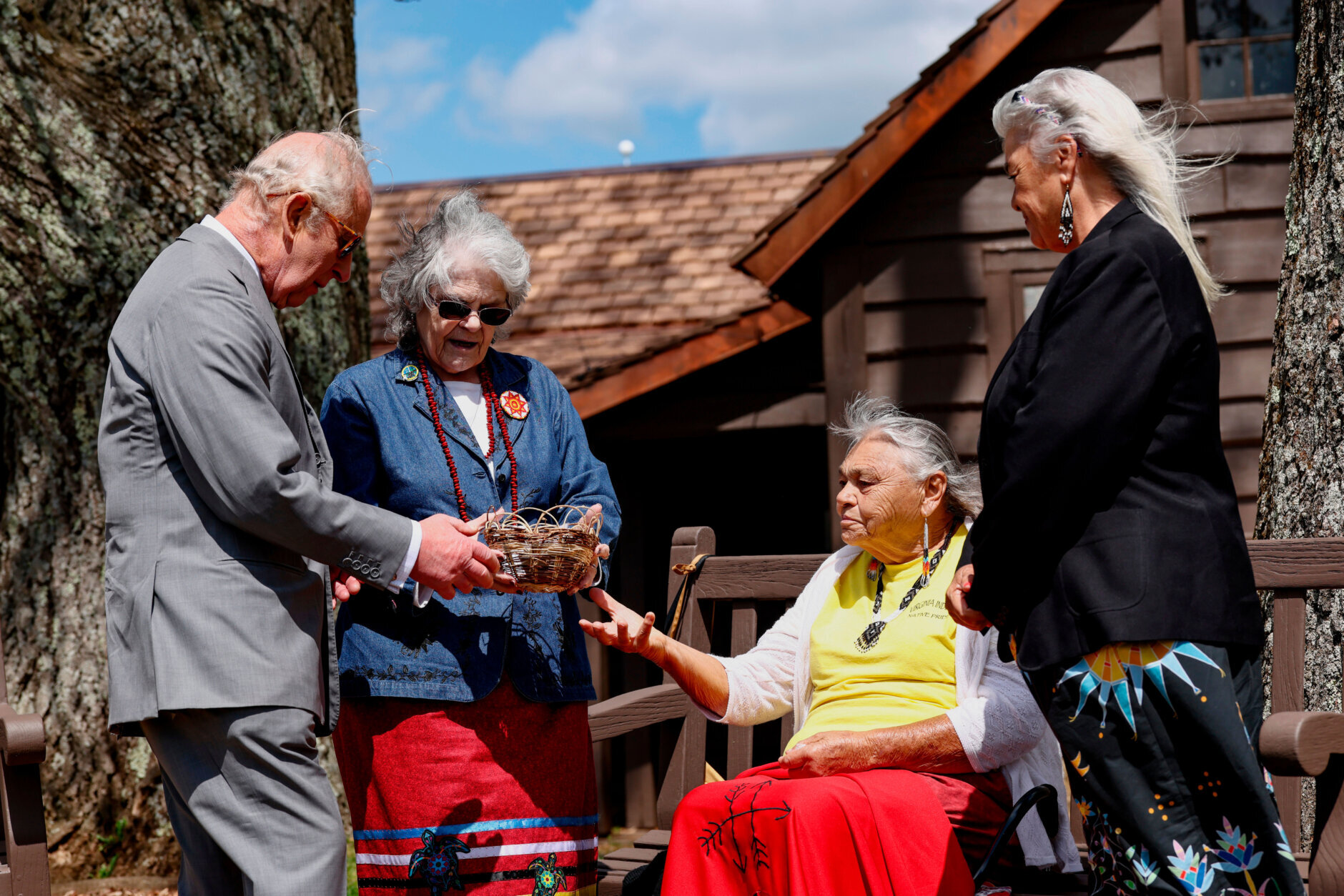 Britain's King Charles, next to Monacan chief Diane Shields, meets with tribe elder Bertie Branham