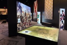 augmented reality exhibit with map and battle displayed